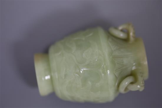 A pair of Chinese carved jade vases and covers, height 12cm